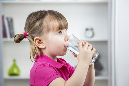 little girl drinking filtered water