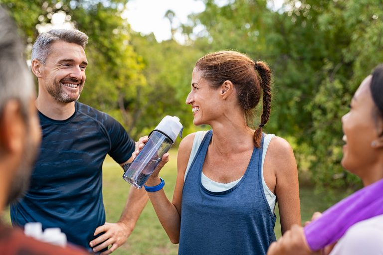friends drinking clean water outside
