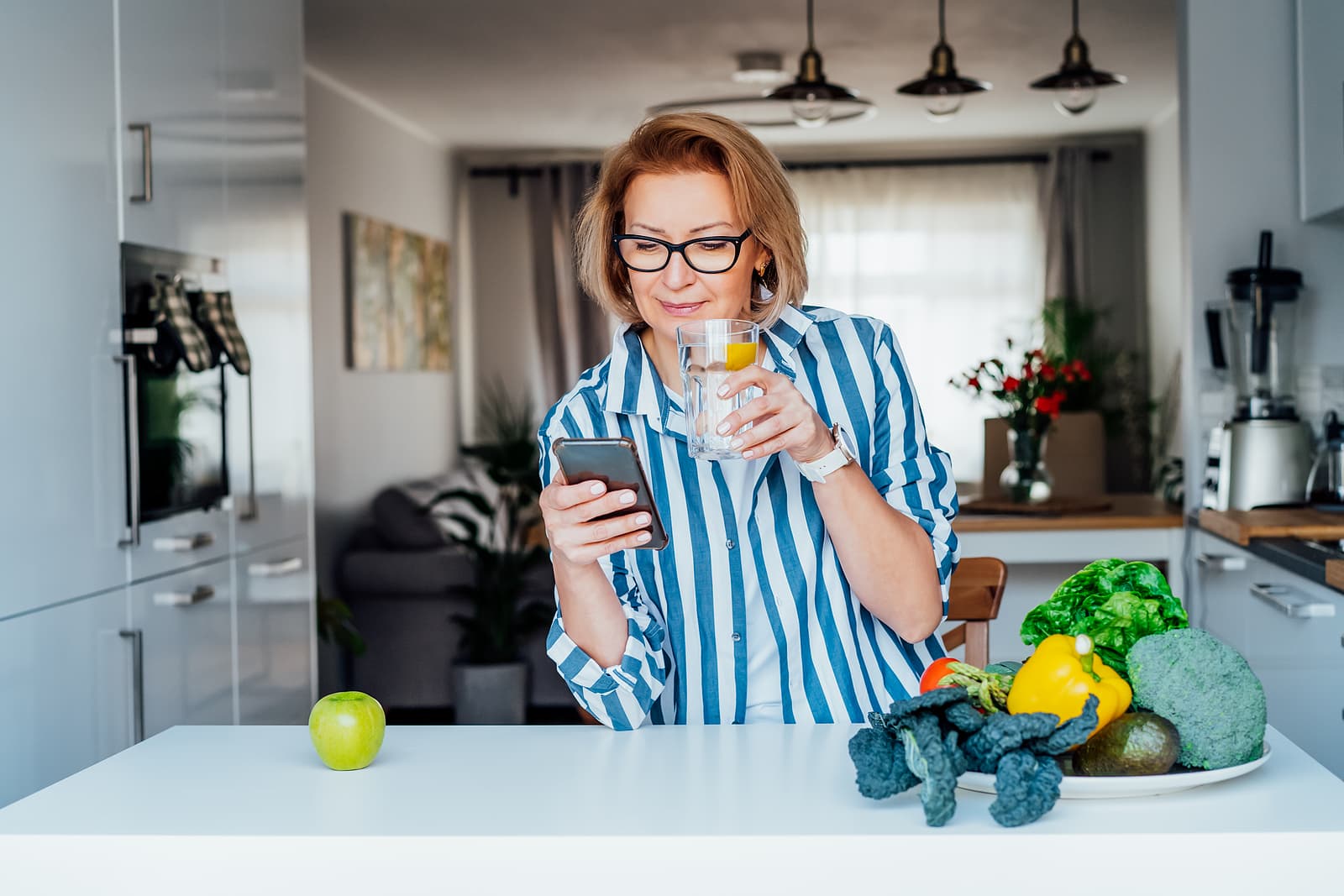 middle aged woman drinking water