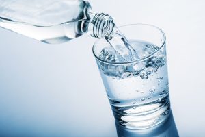 water pouring out of water bottle